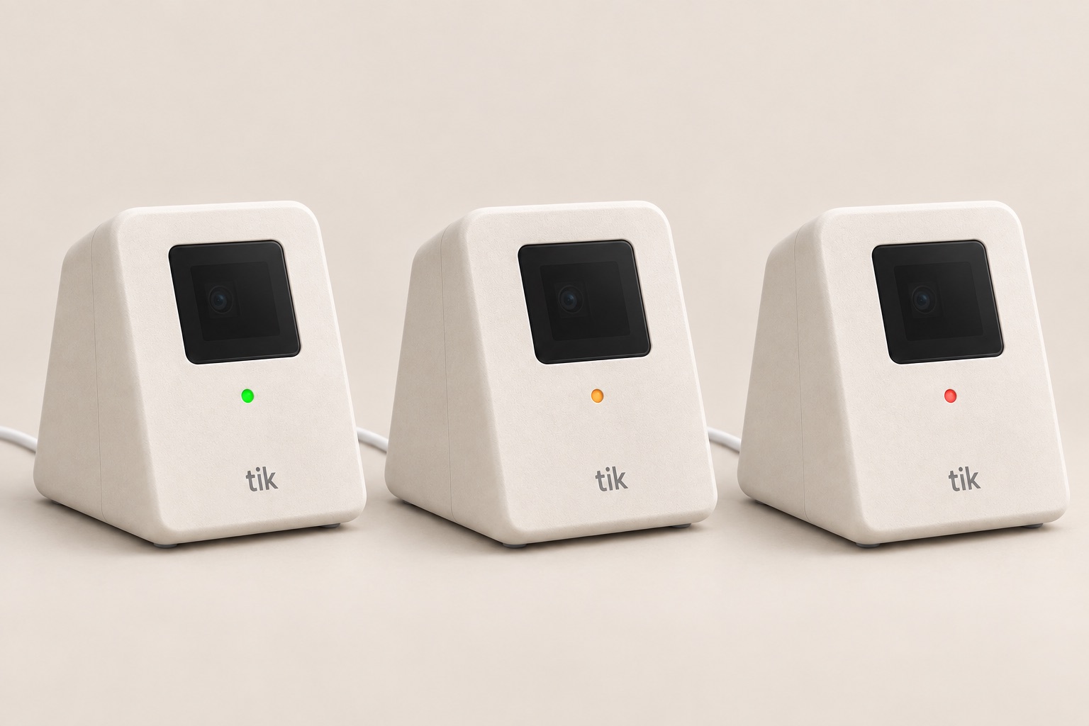Three Tik devices side by side, showing the green, amber and red status lights.